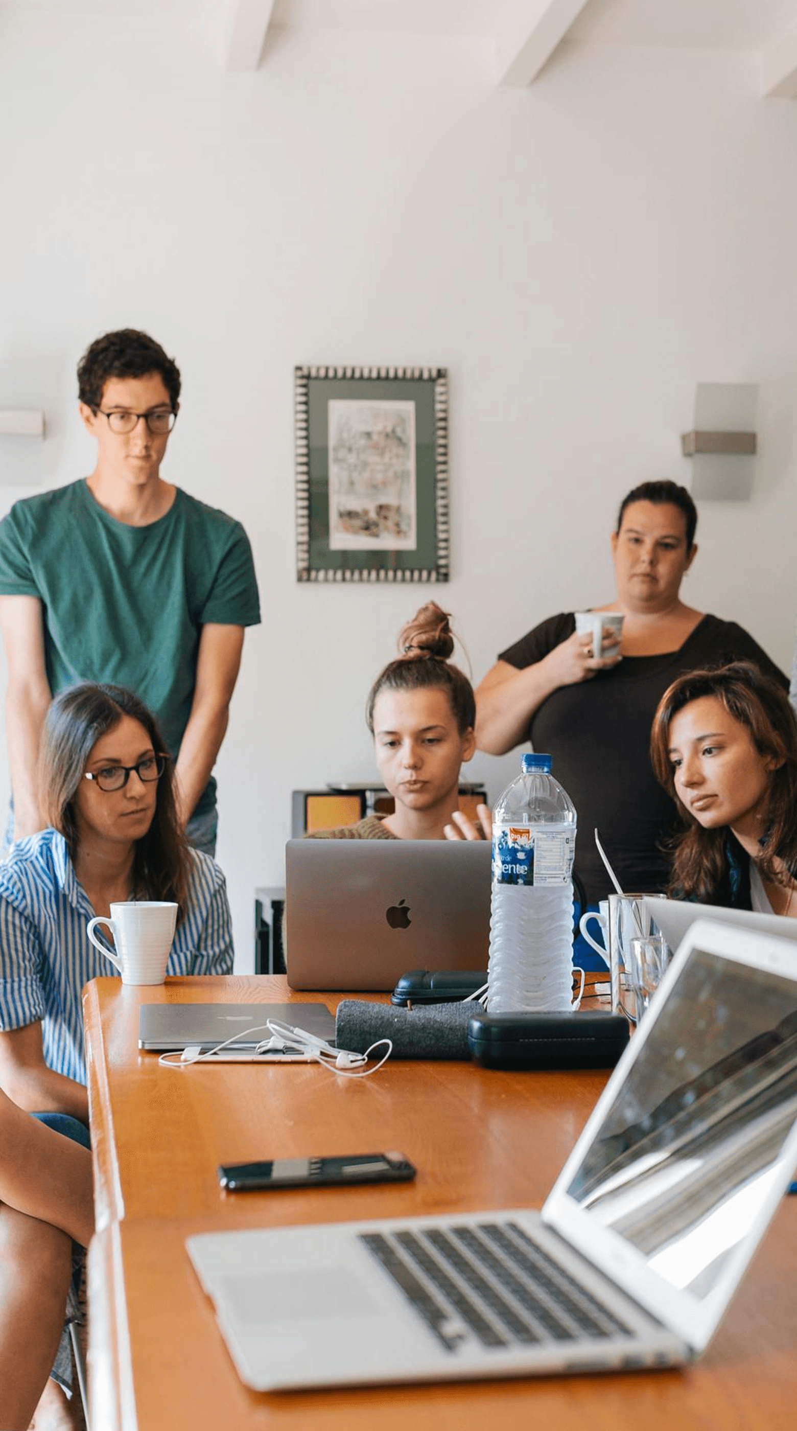 Team collaboration around laptop